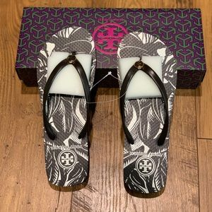 Tory Burch dark brown Hawaiian print flip flops